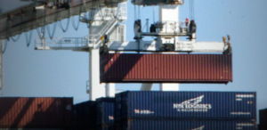 Containers being loaded at dock.